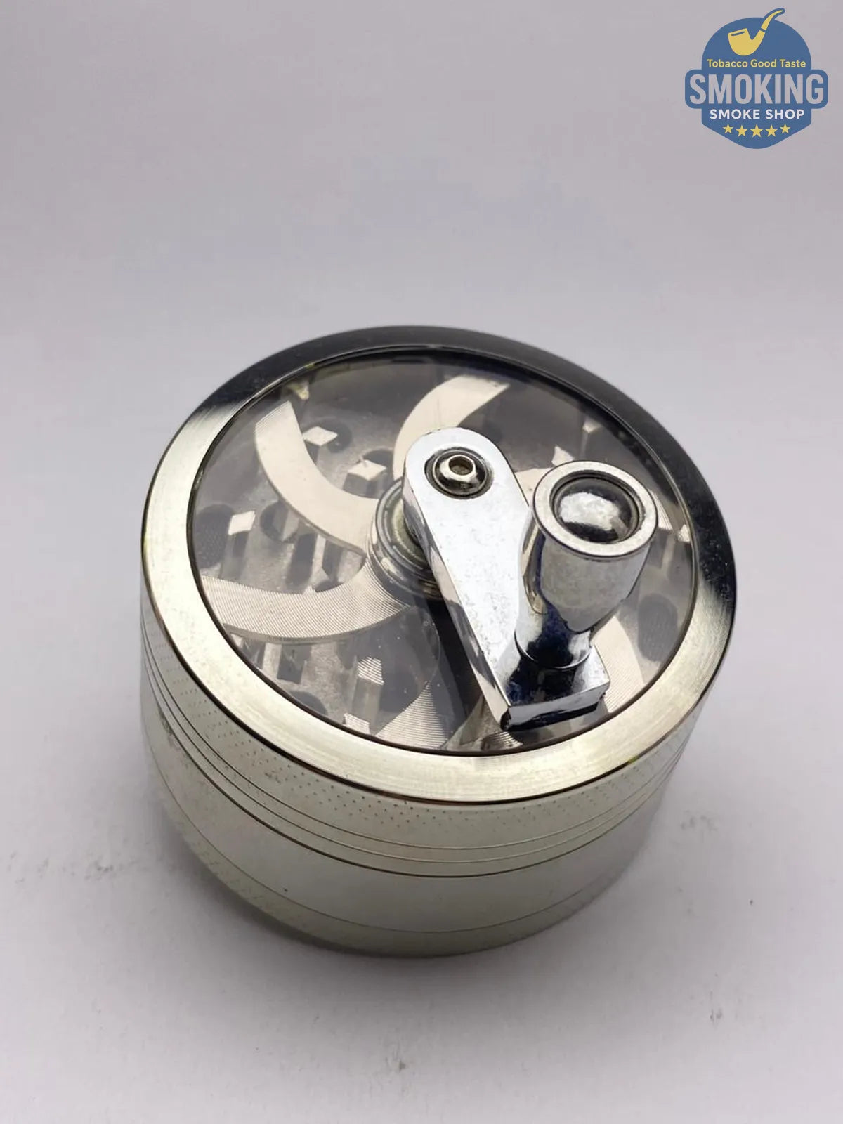مطحنة تبغ معدنية مع ذراع تدوير — Tobacco Grinder with Crank Handle 🌿⚙️